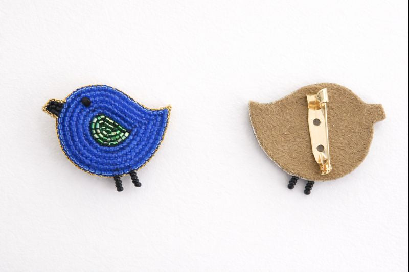 Blue handcrafted bird brooch front and back view showing gold pin clasp - lightweight kids jewelry - Little Pink Llama