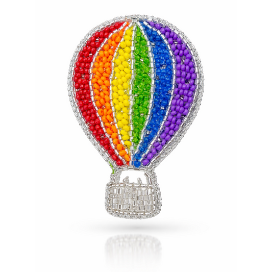 Handmade rainbow hot air balloon brooch front view with multicolour beads and silver basket on white background