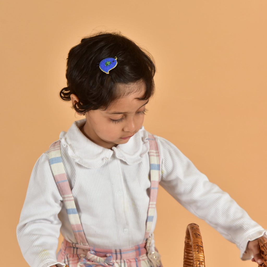Young child wearing blue handcrafted bird hair clip with plaid suspenders - kids felt hair accessory