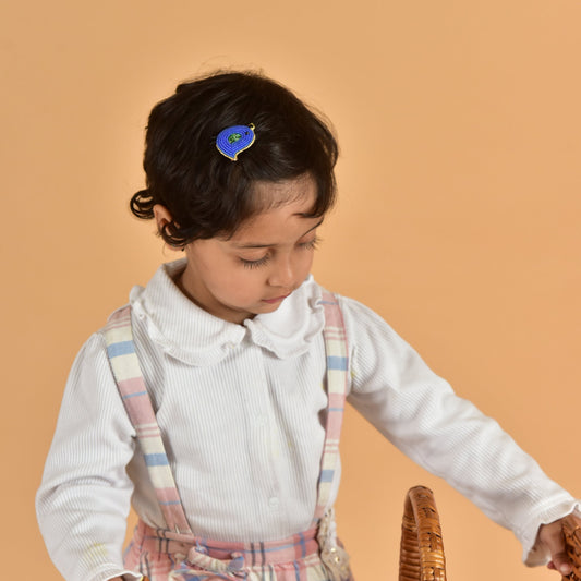Young child wearing blue handcrafted bird hair clip with plaid suspenders - kids felt hair accessory