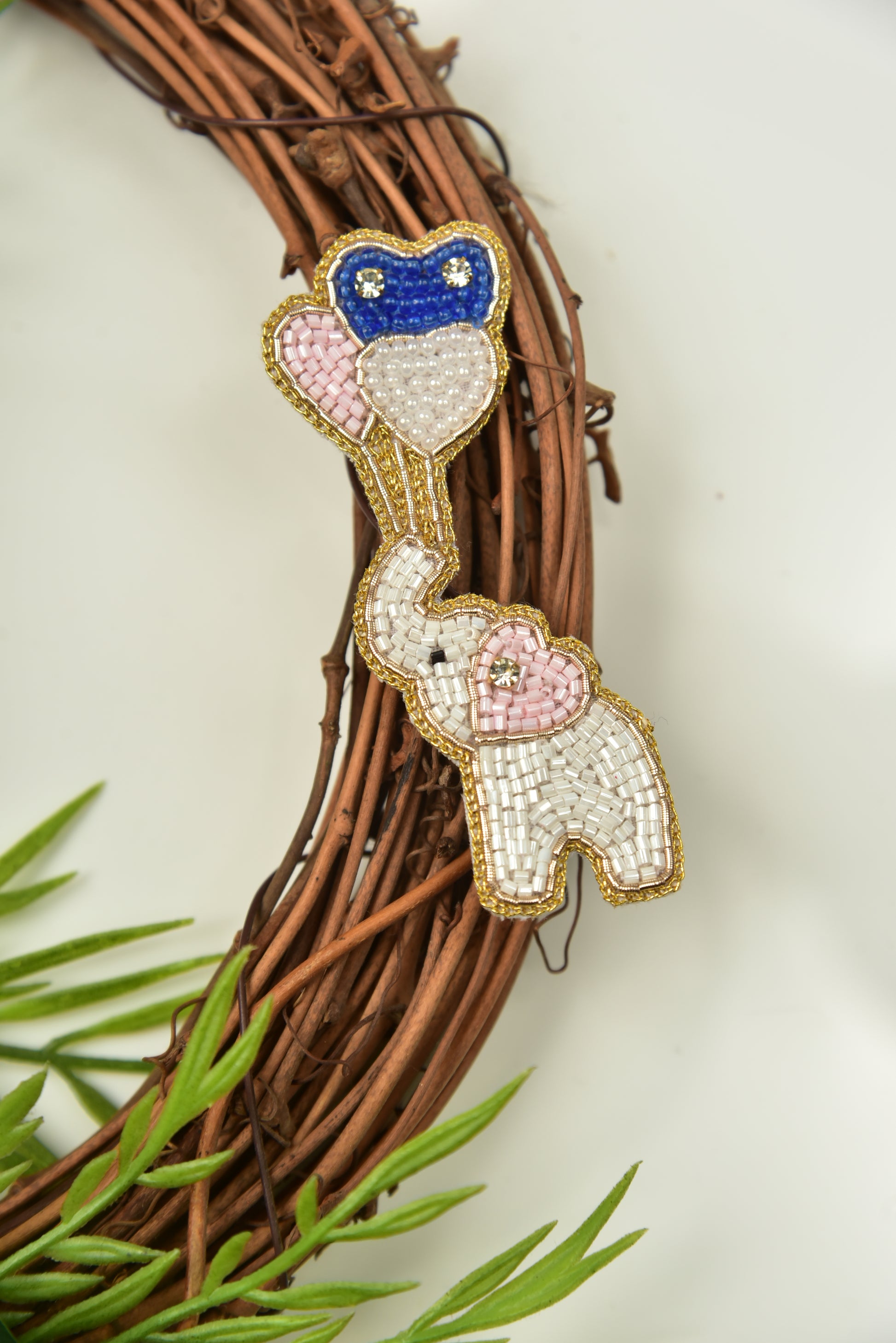 White elephant with balloon hair clip displayed on decorative twig wreath - Little Pink Llama kids clip