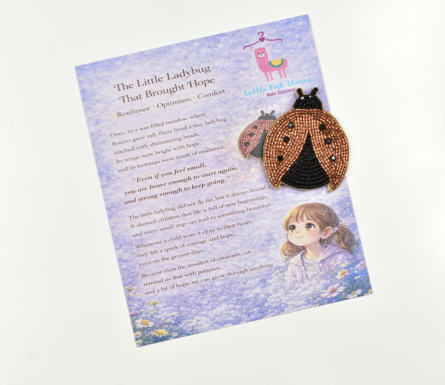 Ladybug hair clip displayed with Little Pink Llama story gift card, perfect for gifting to kids