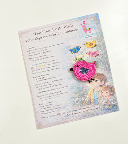 Pink handcrafted bird hair clip displayed on a children's book - ideal gift for girls