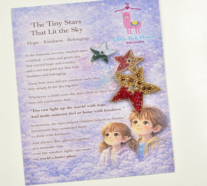 Red and green beaded Guiding Star Hair Clips on Little Pink Llama story card with poem about hope and kindness